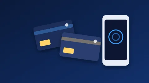 Две NFC-карты Tangem рядом со смартфоном, на экране которого открыто приложение кошелька